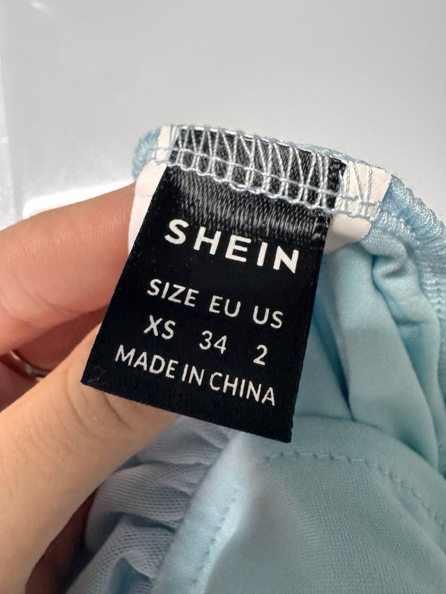 Top azul celeste manga larga