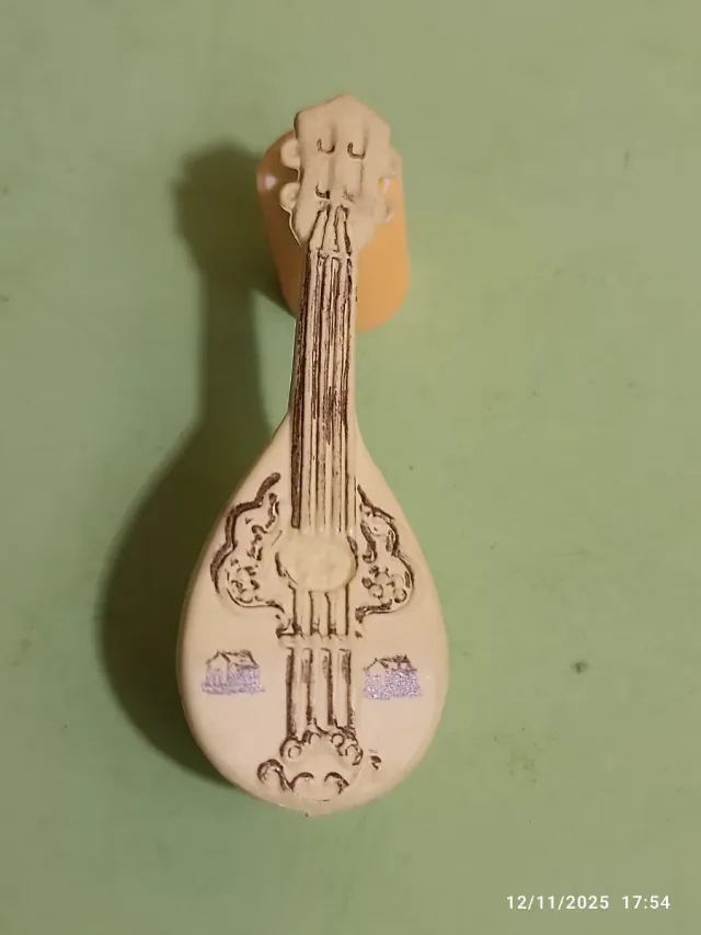 Gommina vintage a forma di mandolino