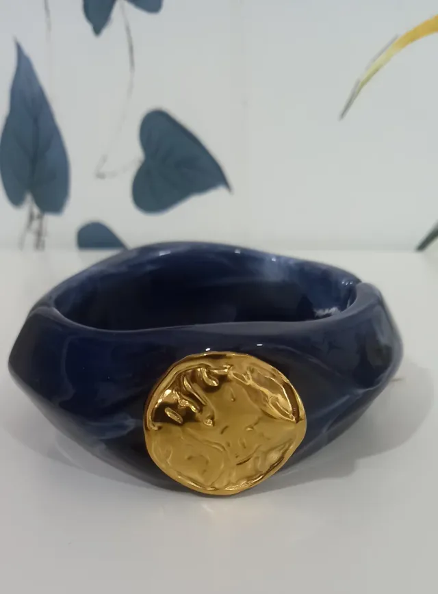 Pulsera azul y dorada