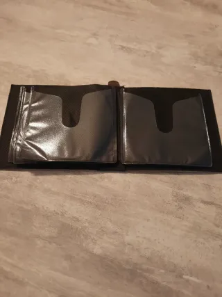 3 cajas de fundas de piel para CD