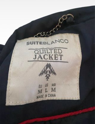 Chaqueta acolchada azul con detalles marrones