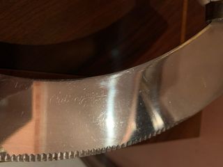 Coltello mezzaluna doppio manico