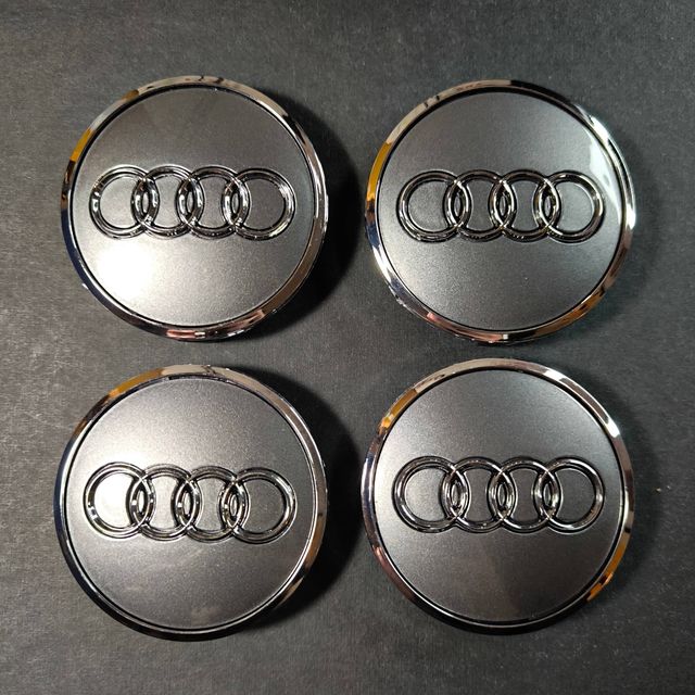 TAPABUJES AUDI 61mm PLATA - EMBLEMA LLANTAS AUDI