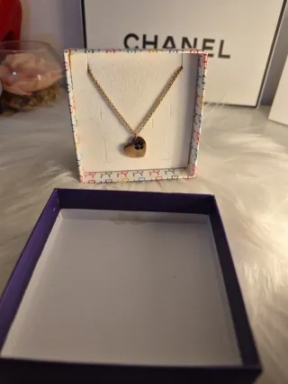 Collana cuore con zampa acciaio dorato