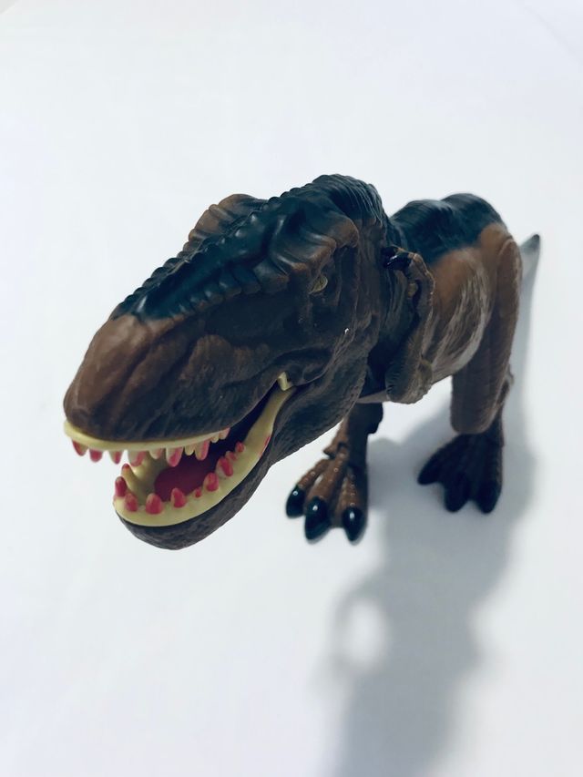 Dinosauro giocattolo interattivo marrone e nero
