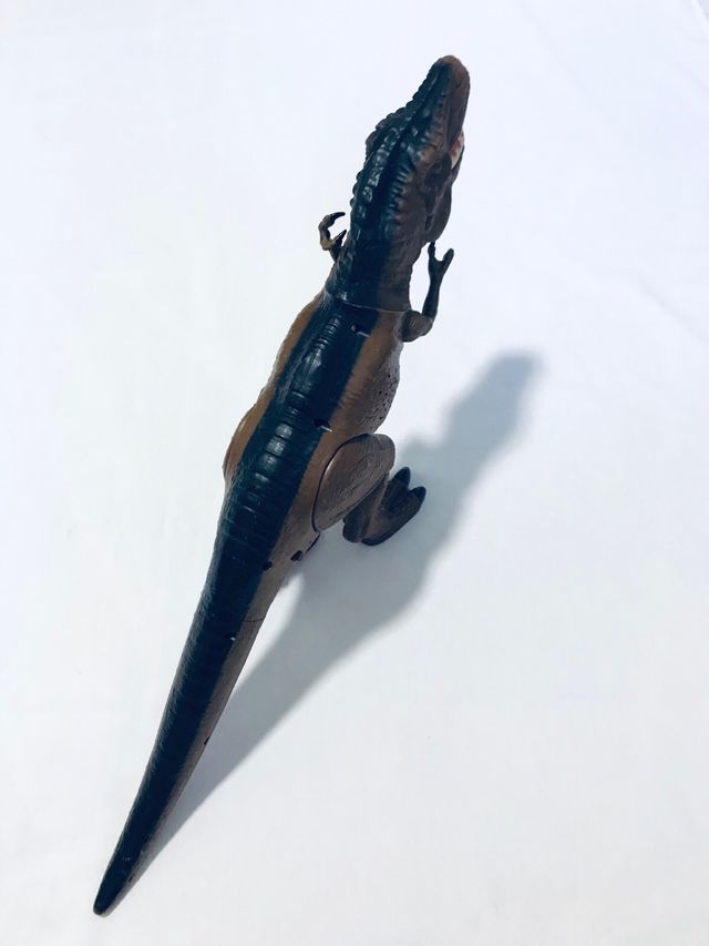 Dinosauro giocattolo interattivo marrone e nero