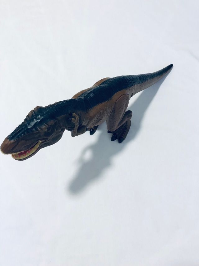 Dinosauro giocattolo interattivo marrone e nero