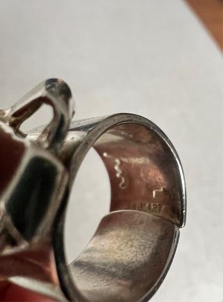 2 Anillos Plata uno ajustable.