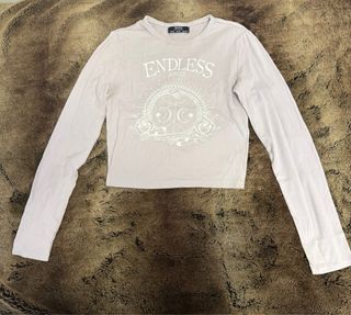 Camiseta Bershka manga larga lila estampada