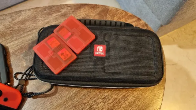 Nintendo Switch OLED Azul/Rojo + funda