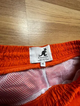 Pantalones parachute retro Kangol talla XS