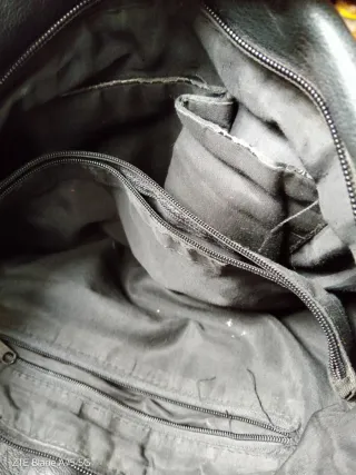 Bolso cuero negro flecos tachuelas