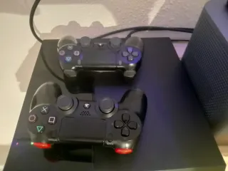 Consola PS4 + FIFA 26 y otros juegos más.