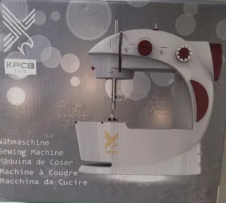 Máquina de coser blanca y roja