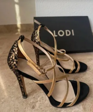 Sandalias Lodi fiesta negras y doradas Negociable