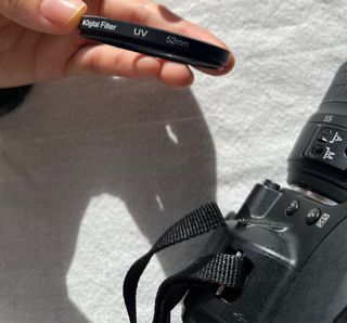 Cámara Nikon D3100 con objetivo y cargador