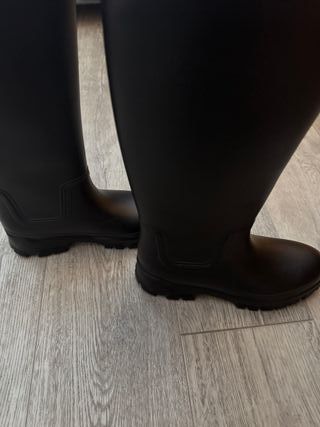 Botas altas negras hasta la rodilla