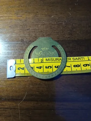 Antico fermasoldi con stemma inciso