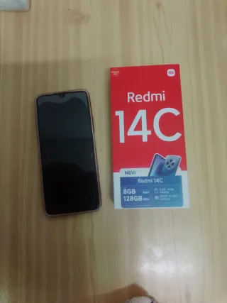 Teléfono móvil negro con funda rosa urge la venta