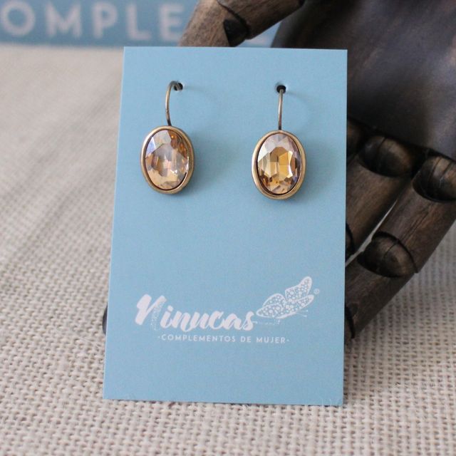 Pendientes color dorado envejecido con óvalo CH