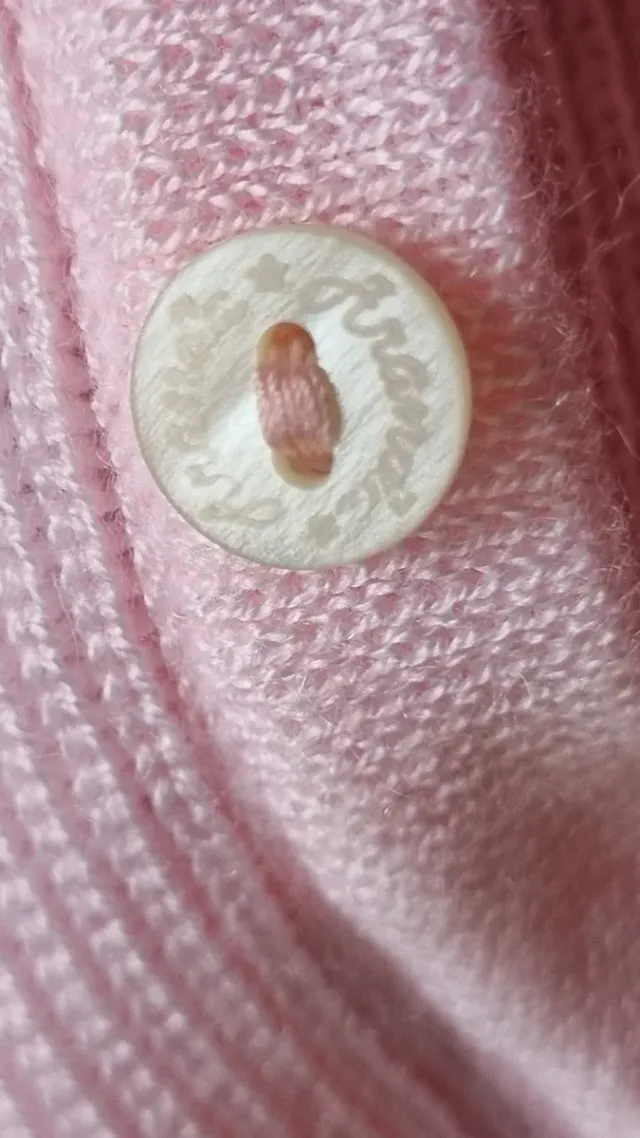 Vestido de bebé rosa tejido y tela