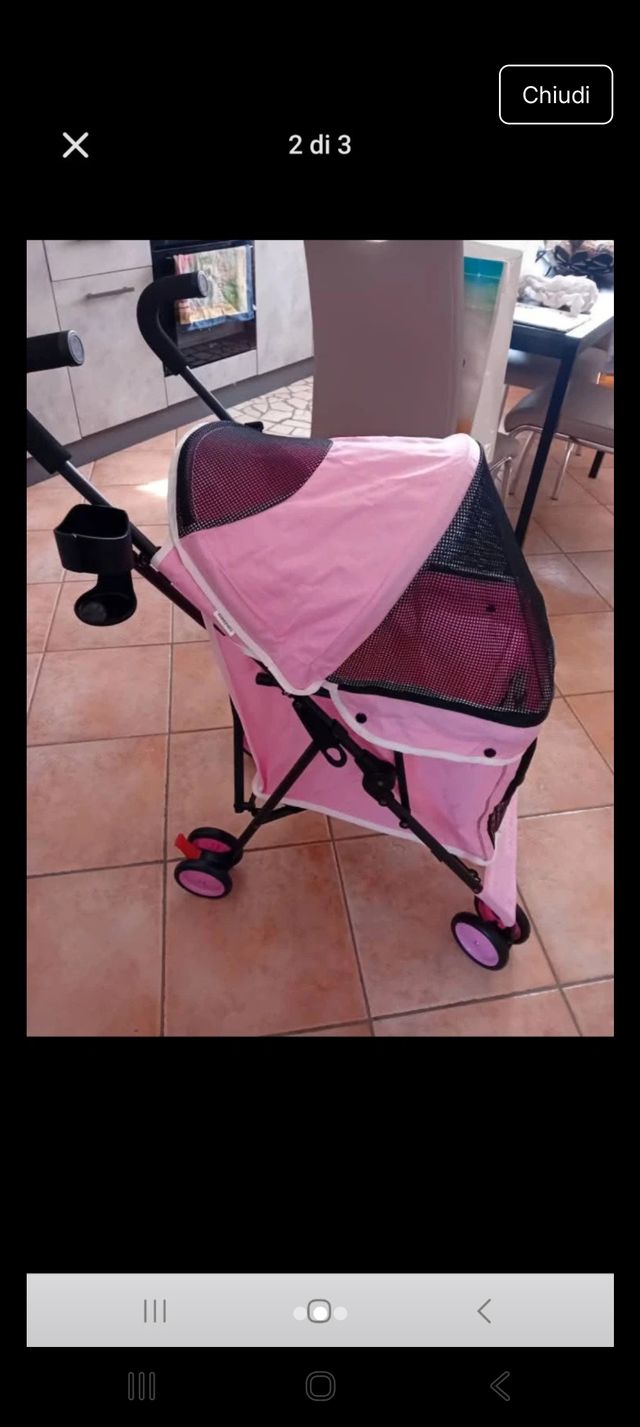 Passeggino per cani rosa