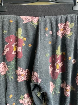 Tuta Tezenis nera con fiori rosa