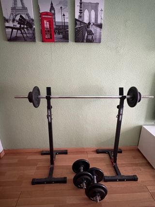 Soporte para sentadillas con barra y discos