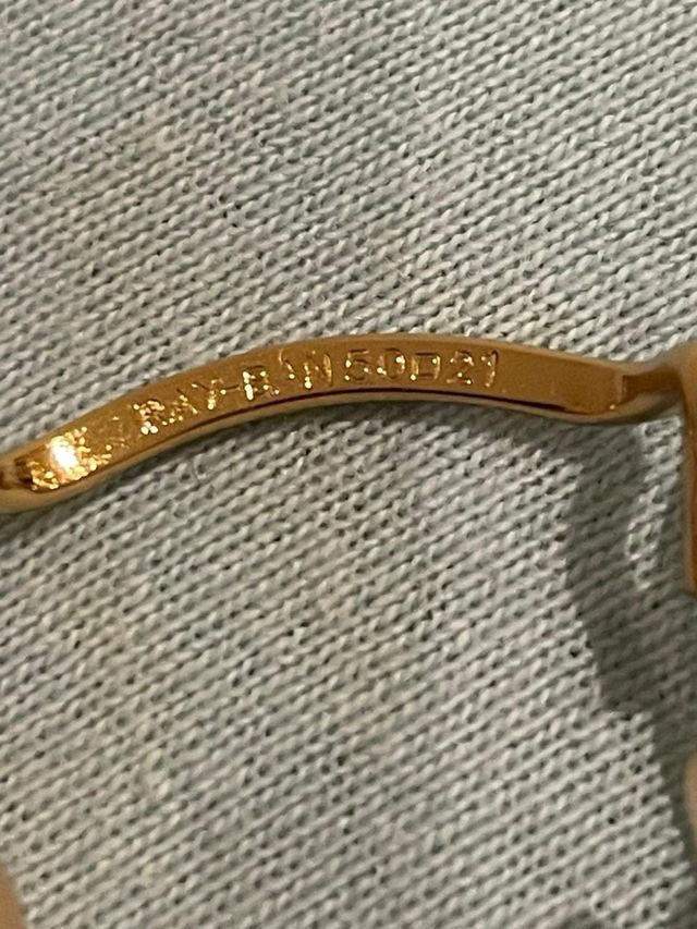 Gafas Ray-Ban doradas y marrones