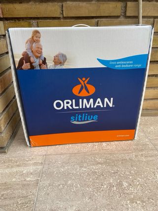 Silla de ruedas y Cojín ortopédico