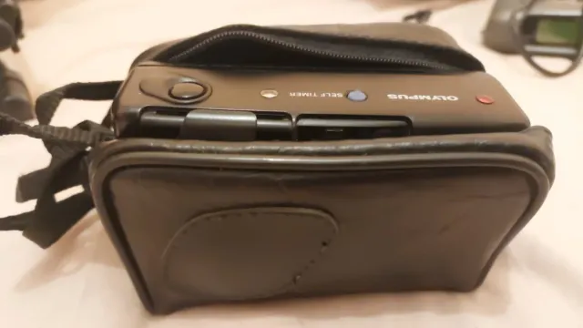 Cámara Olympus con funda camara cannon