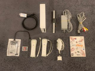 Wii, mandos y +100 juegos.