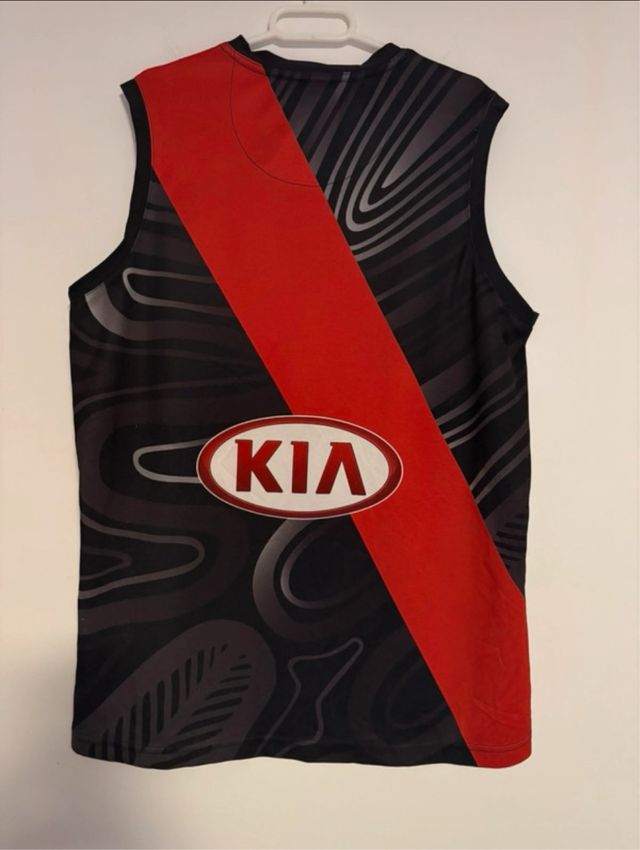 Camiseta AFL Essendon Bombers – Edição Indígena