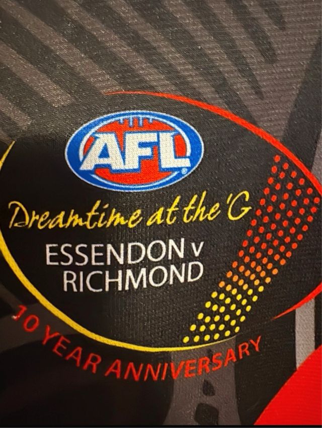 Camiseta AFL Essendon Bombers – Edição Indígena
