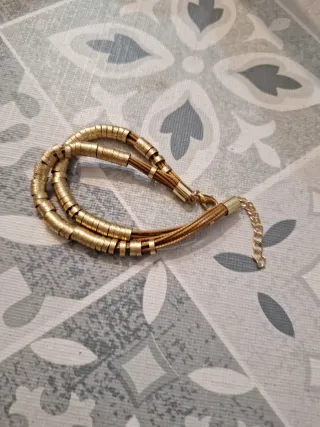 Pulsera Parfois dorada y marrón