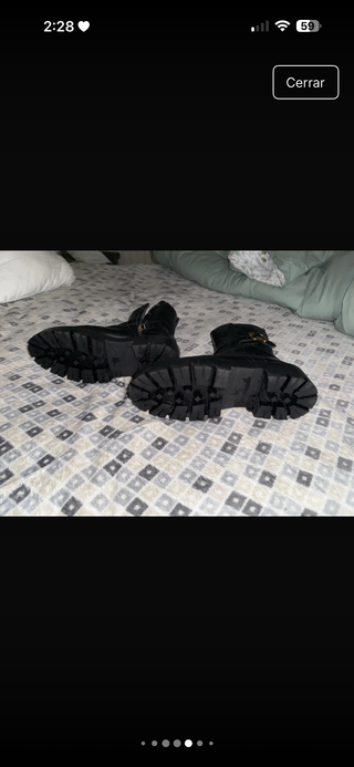 Botín cuero suela track con hebilla