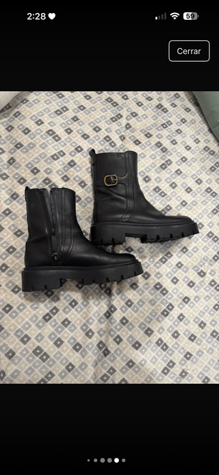 Botín cuero suela track con hebilla