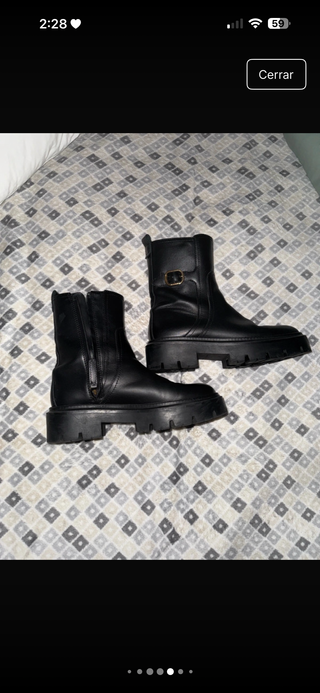 Botín cuero suela track con hebilla