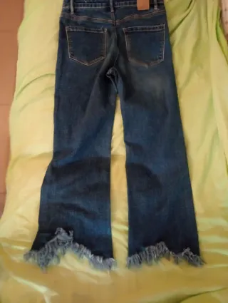 Pantalón tejano mujer flare deshilachado