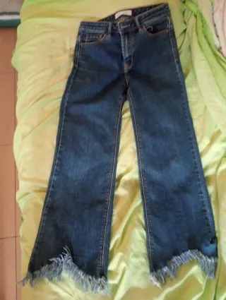 Pantalón tejano mujer flare deshilachado