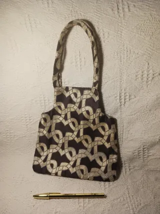 Bolso de fiesta negro y dorado