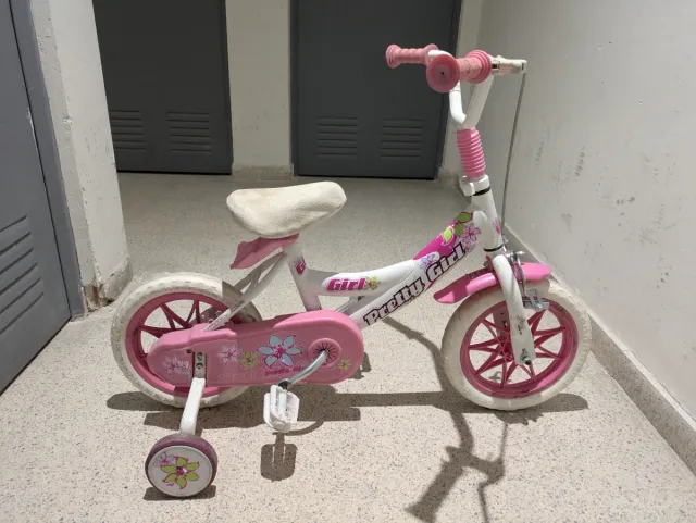 Bici niña rosa con ruedines