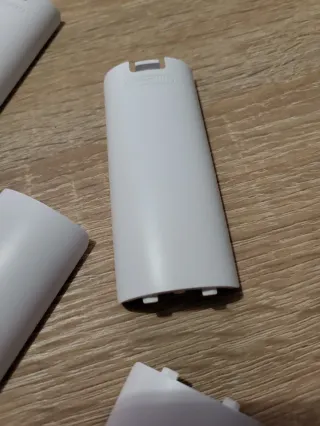 Tapa Pilas WiiMote Nintendo