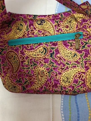 Riñonera Caomka monedero morado y turquesa