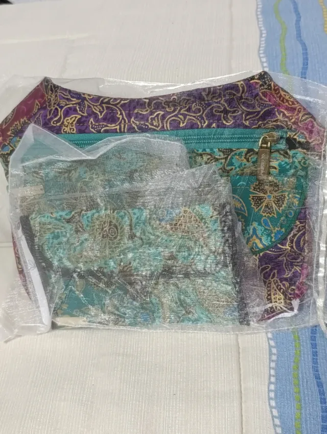 Riñonera Caomka monedero morado y turquesa