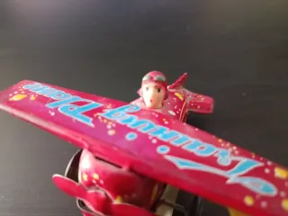 Avión a cuerda de hojalata vintage