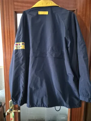 Cortaviento In Extenso azul y amarilla