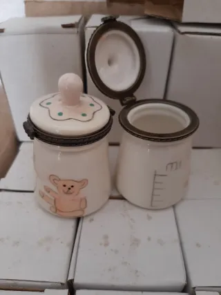 24 bomboniere a forma di biberon e di dado