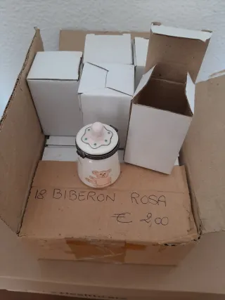 24 bomboniere a forma di biberon e di dado