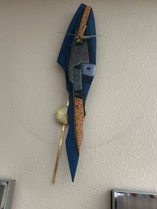 Reloj de pared con péndulo